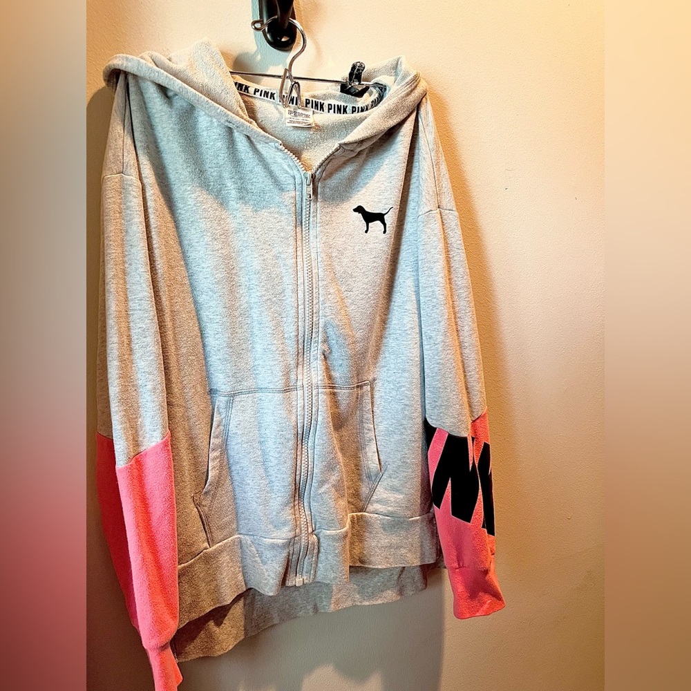 Pink zip up hoodie.